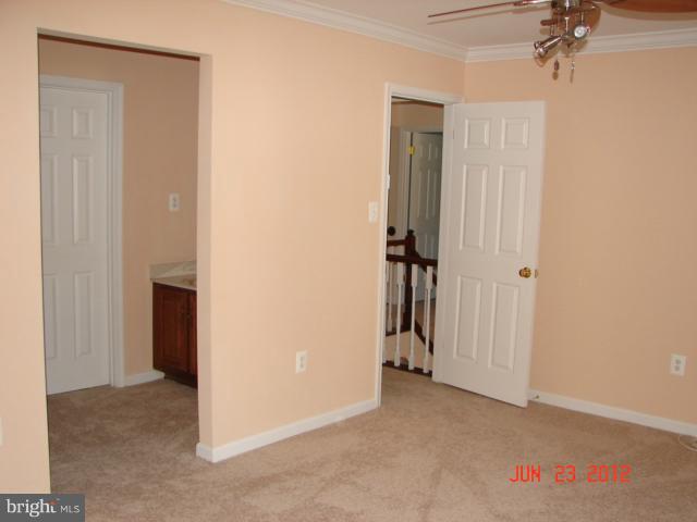 10414 Mountain Quail Road Silver Spring, MD 20901 - Photo 4 of 22 an empty room with a hallway