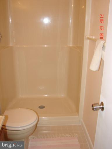 10414 Mountain Quail Road Silver Spring, MD 20901 - Photo 8 of 22 a bathroom with a toilet and a shower