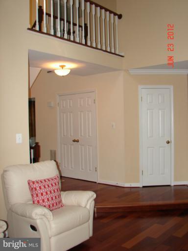 10414 Mountain Quail Road Silver Spring, MD 20901 - Photo 9 of 22 a view of wooden floor and chair in a room
