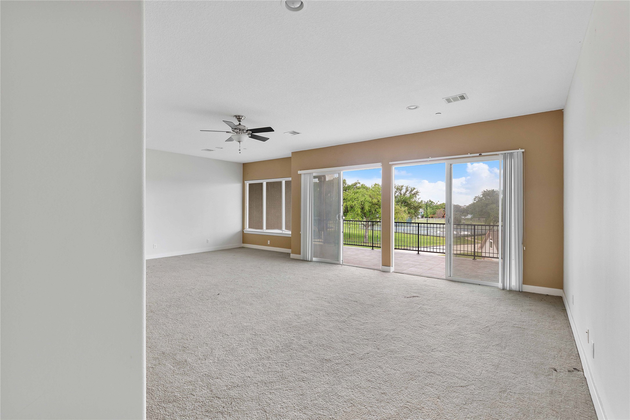 11446 Ketch Court Willis, TX 77318 - Photo 12 of 16 a view of an empty room with a window