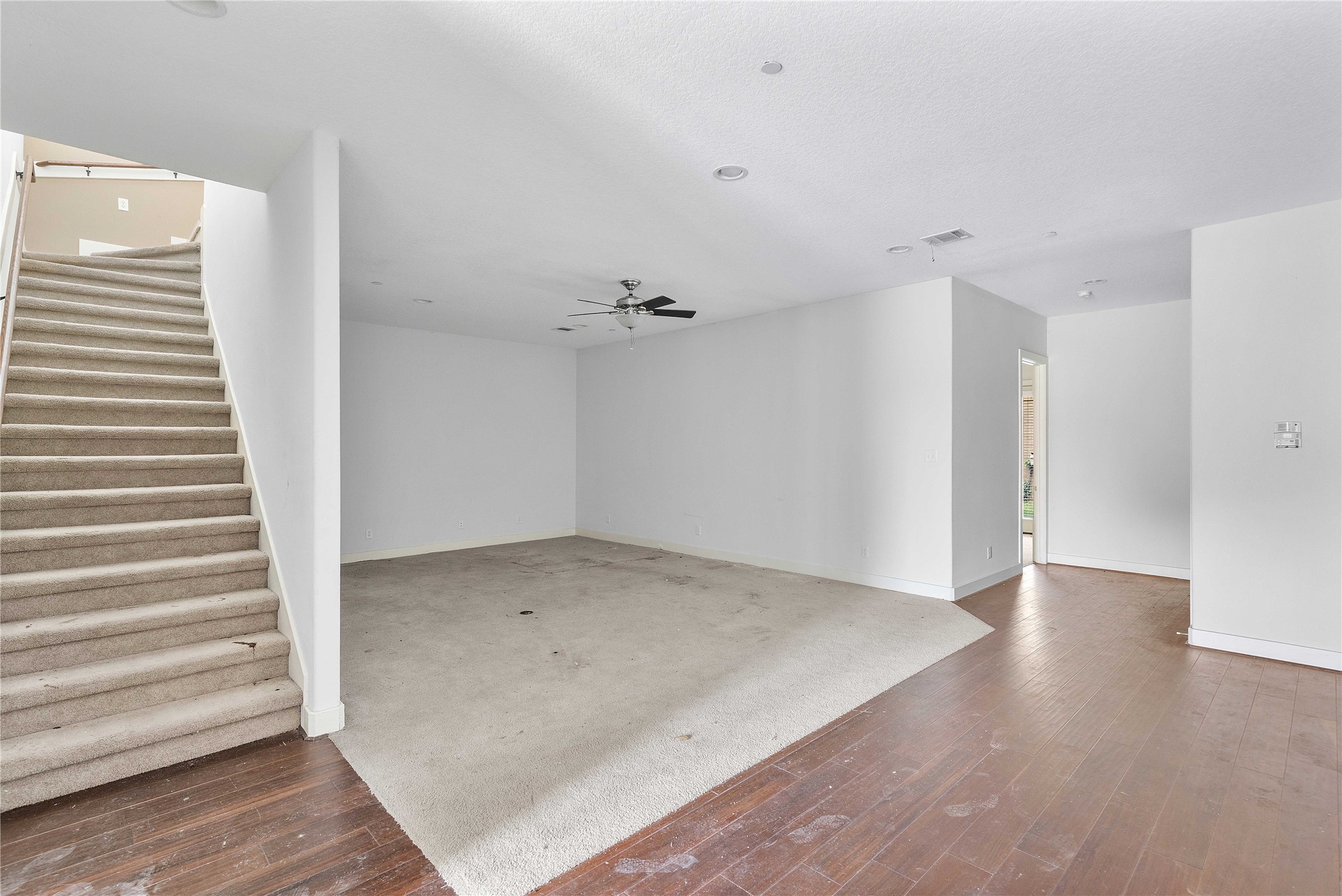 11446 Ketch Court Willis, TX 77318 - Photo 6 of 16 an empty room with wooden floor and windows