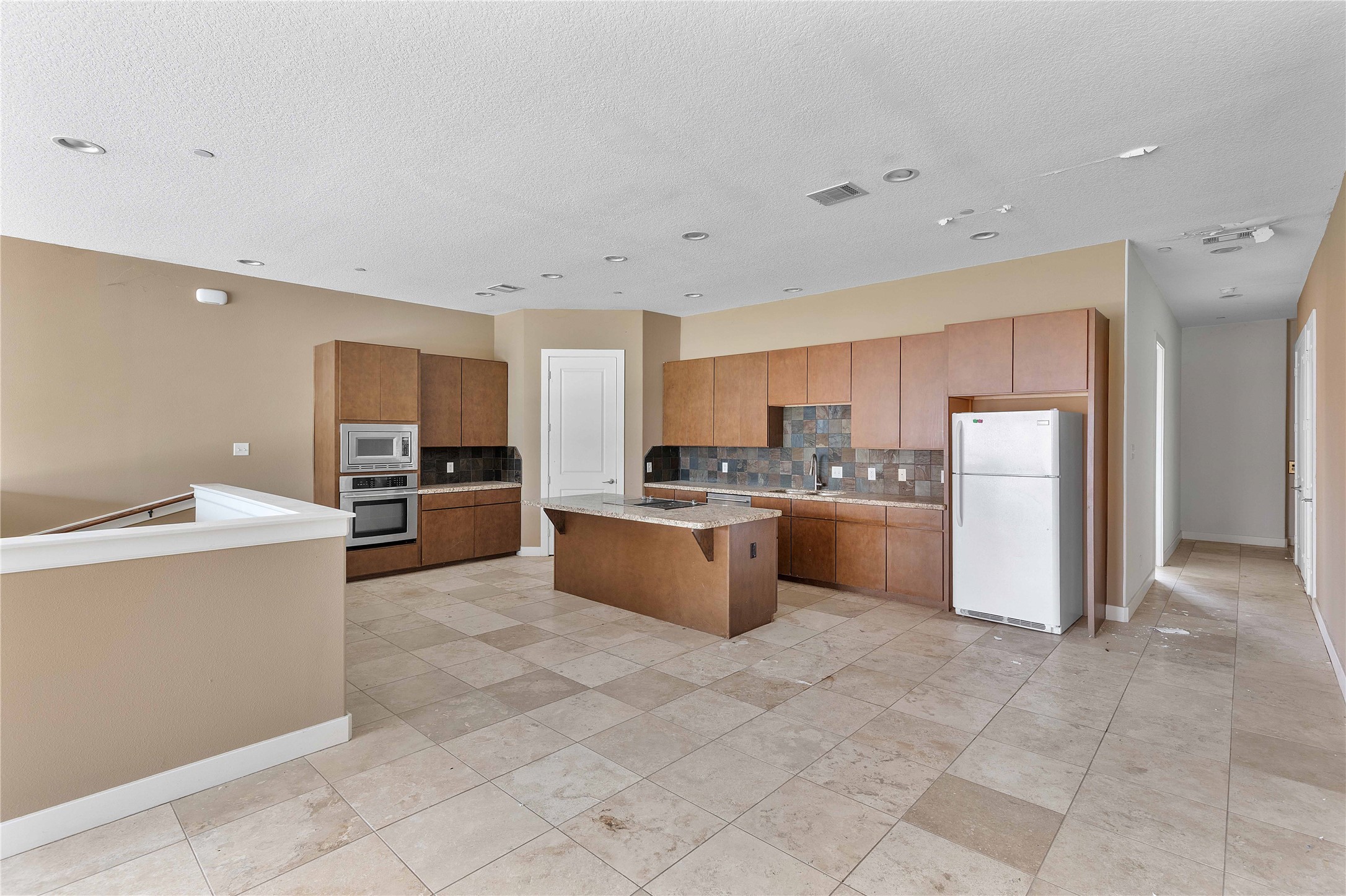 11446 Ketch Court Willis, TX 77318 - Photo 8 of 16 a large kitchen with a large counter top appliances and cabinets