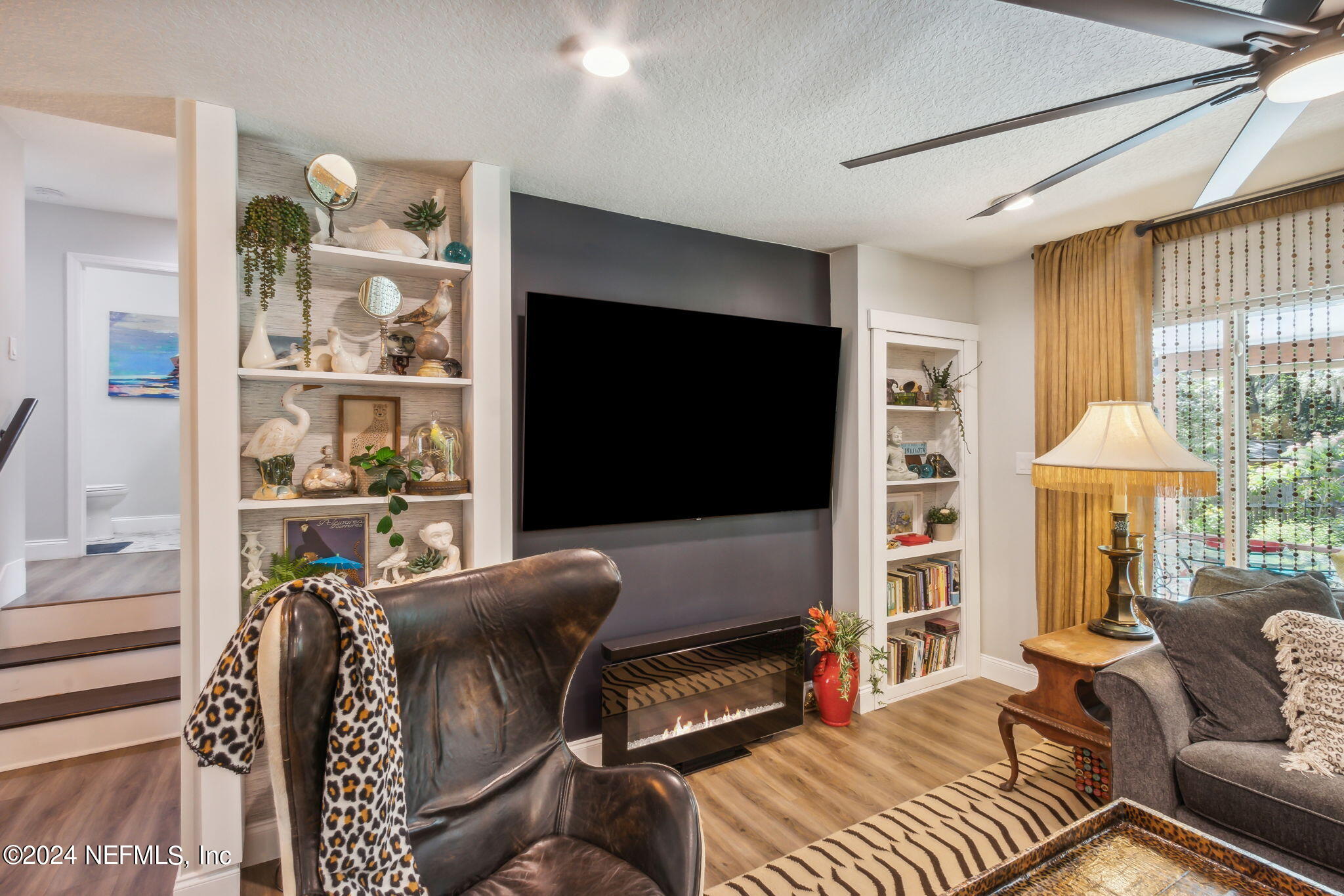 2636 Elbow Road Orange Park, FL 32073 - Photo 11 of 43 a living room with furniture and a flat screen tv