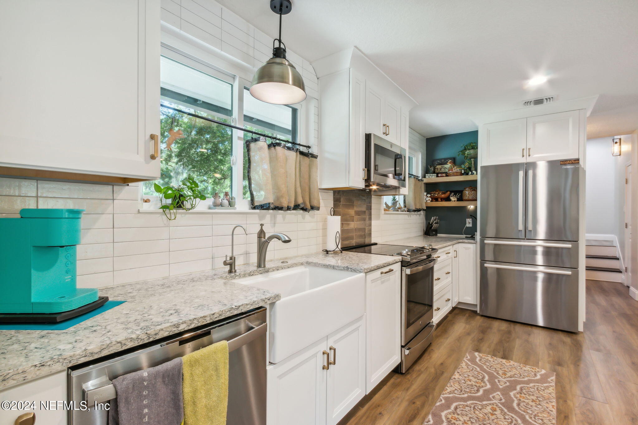 2636 Elbow Road Orange Park, FL 32073 - Photo 14 of 43 a kitchen with stainless steel appliances granite countertop a sink a stove and a refrigerator