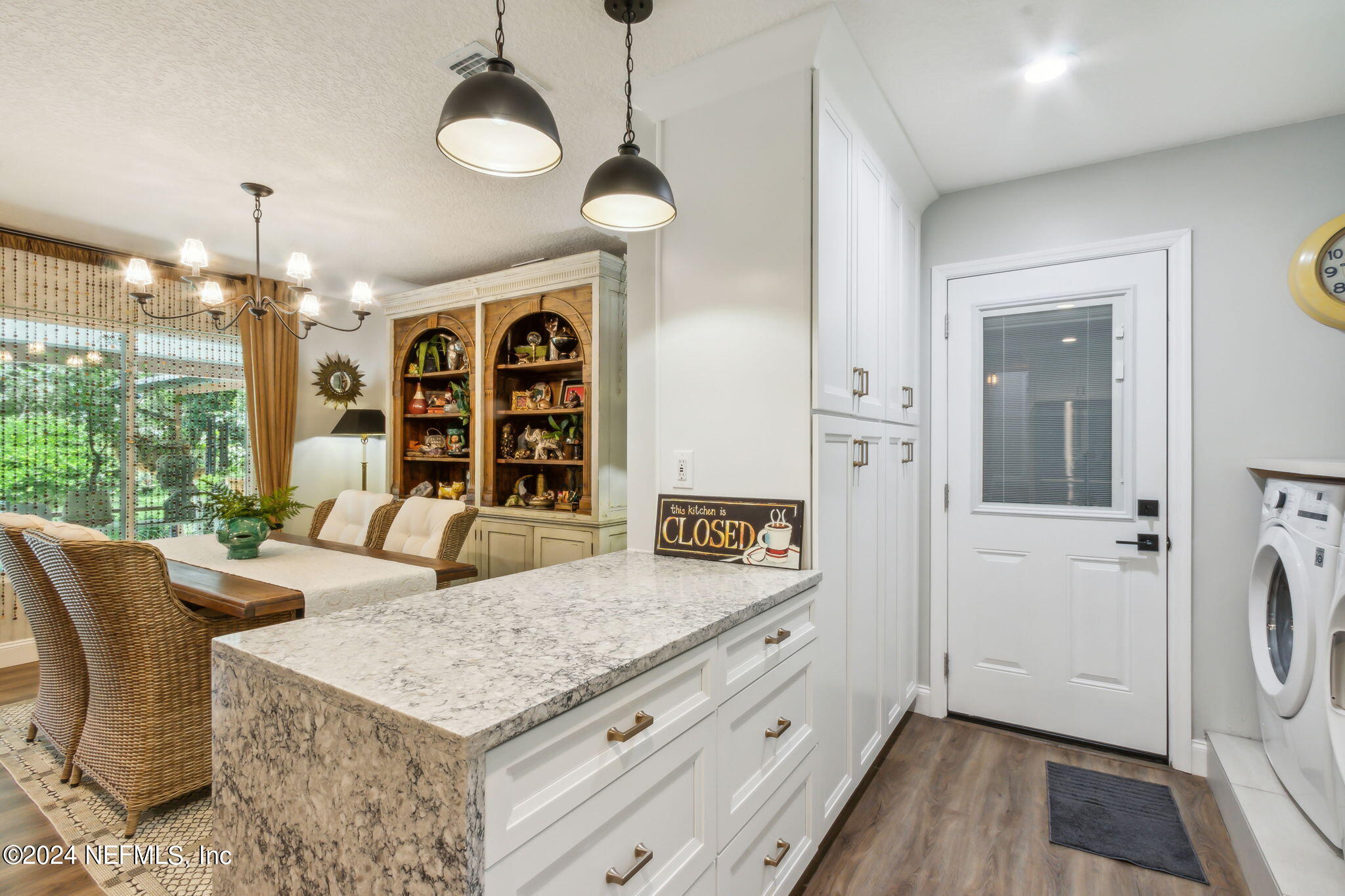 2636 Elbow Road Orange Park, FL 32073 - Photo 16 of 43 a view of a kitchen area kitchen island furniture and wooden floor