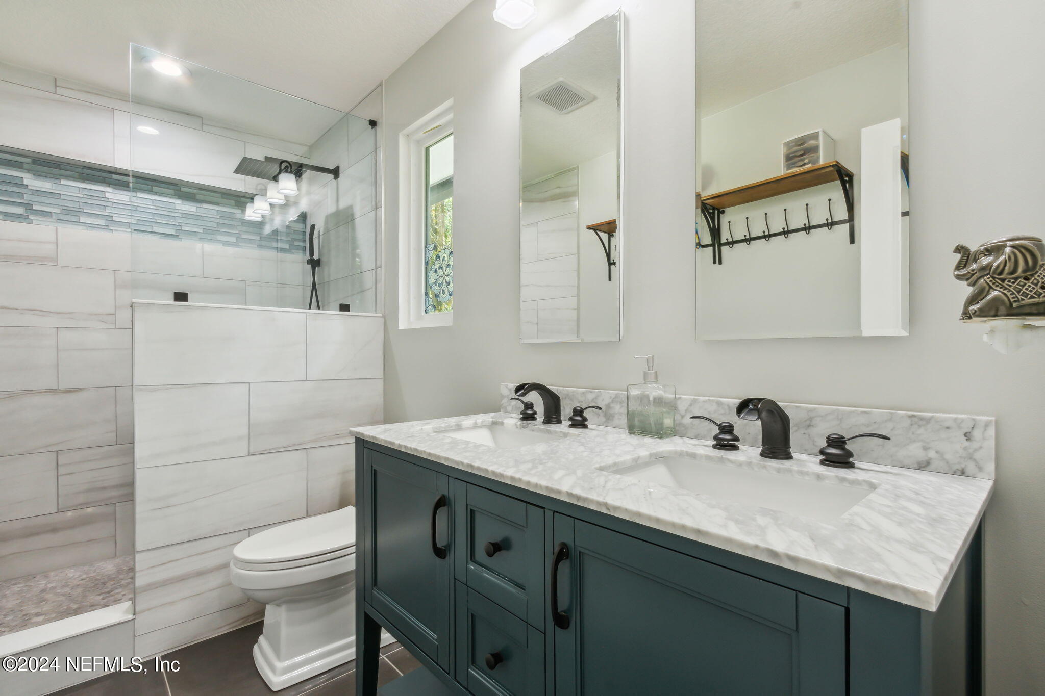 2636 Elbow Road Orange Park, FL 32073 - Photo 20 of 43 a bathroom with a granite countertop sink a toilet and a mirror