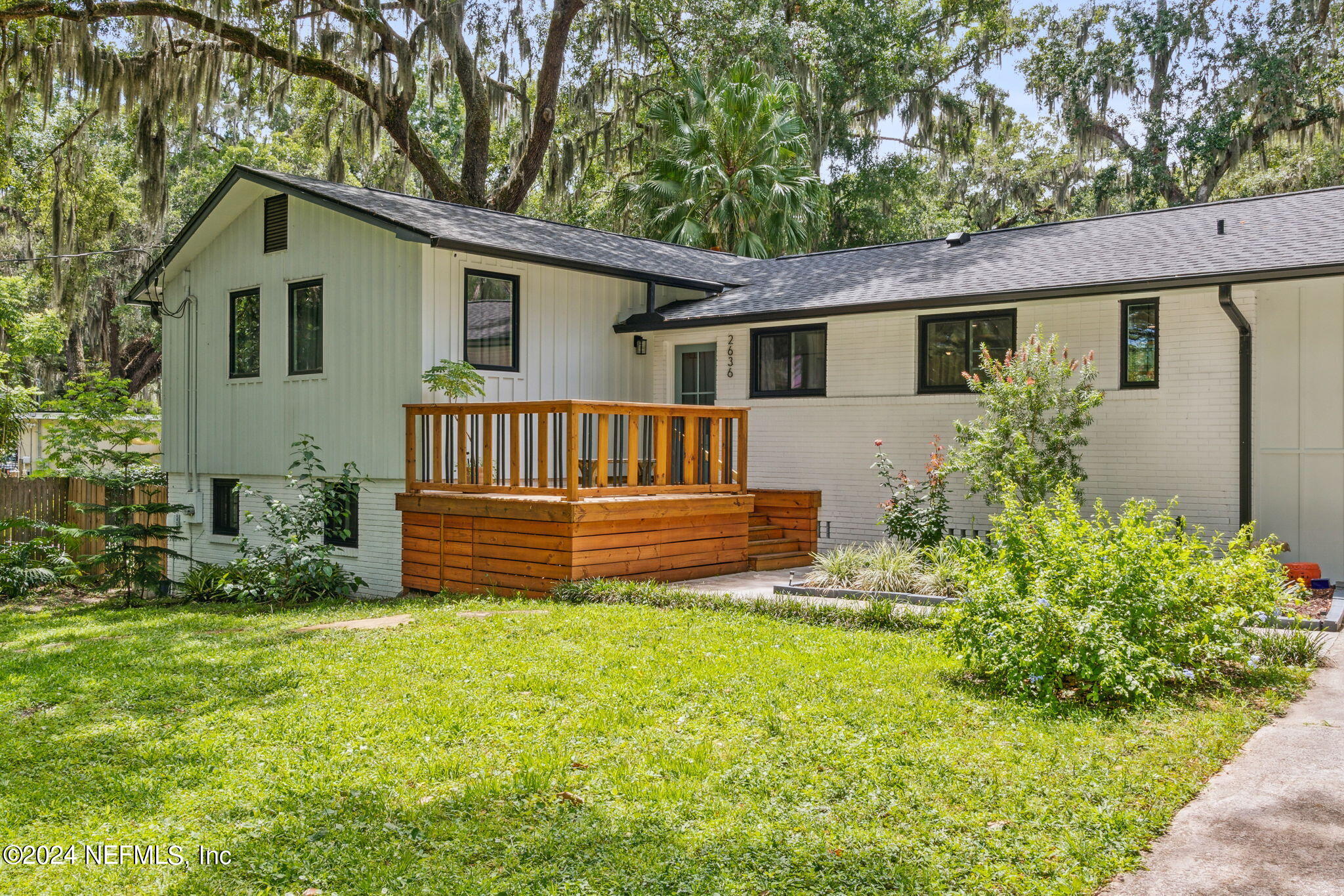 2636 Elbow Road Orange Park, FL 32073 - Photo 2 of 43 a view of a house with a yard and plants