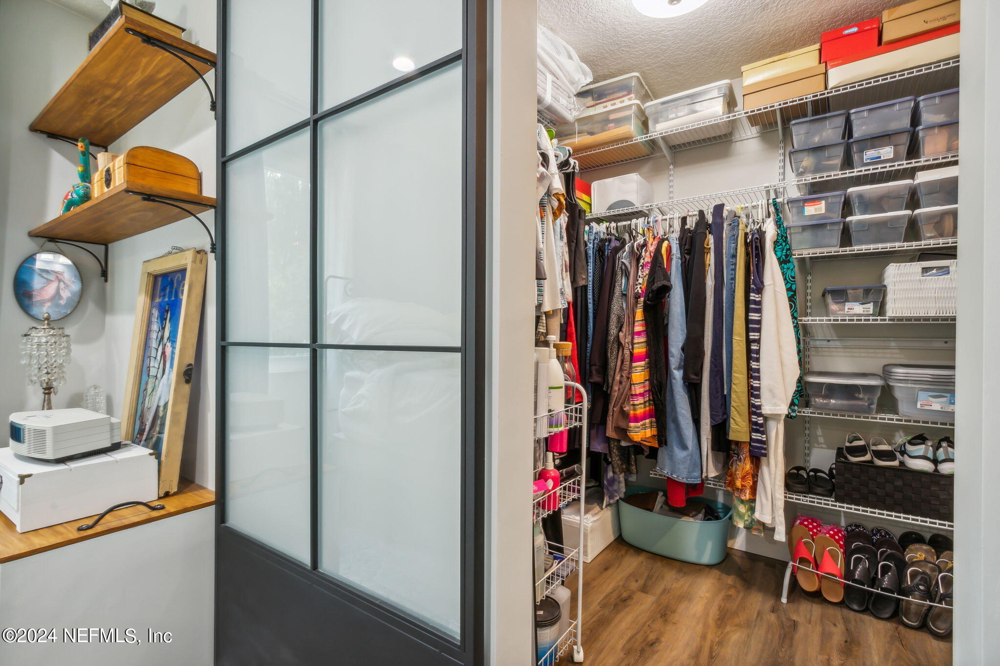 2636 Elbow Road Orange Park, FL 32073 - Photo 21 of 43 a view of walk in closet with clothes and shoes