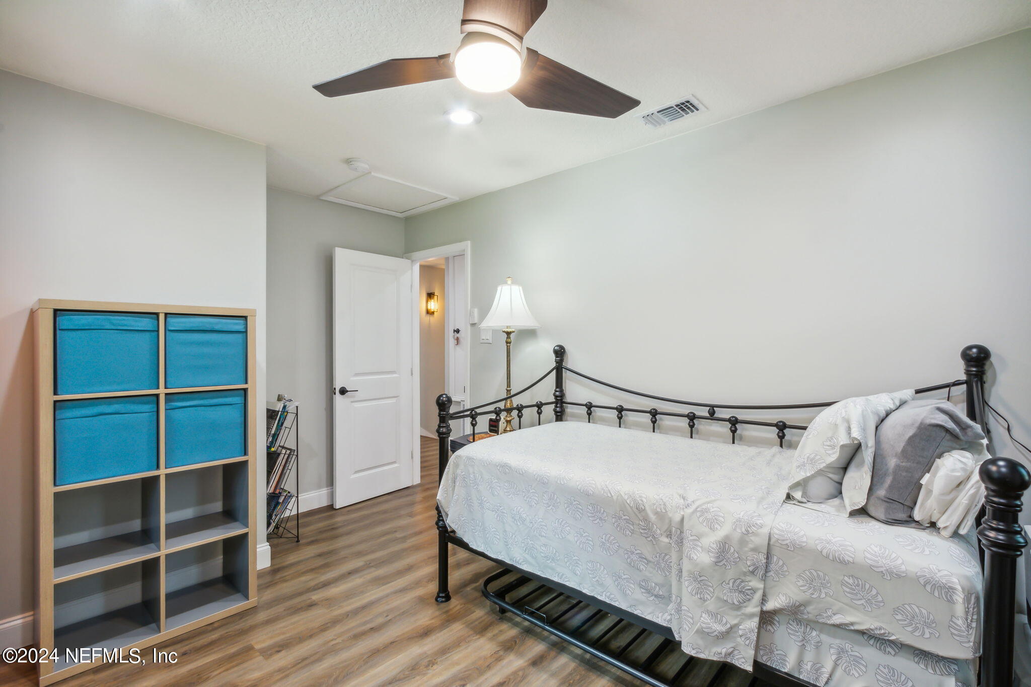 2636 Elbow Road Orange Park, FL 32073 - Photo 23 of 43 a bedroom with a bed and a chandelier