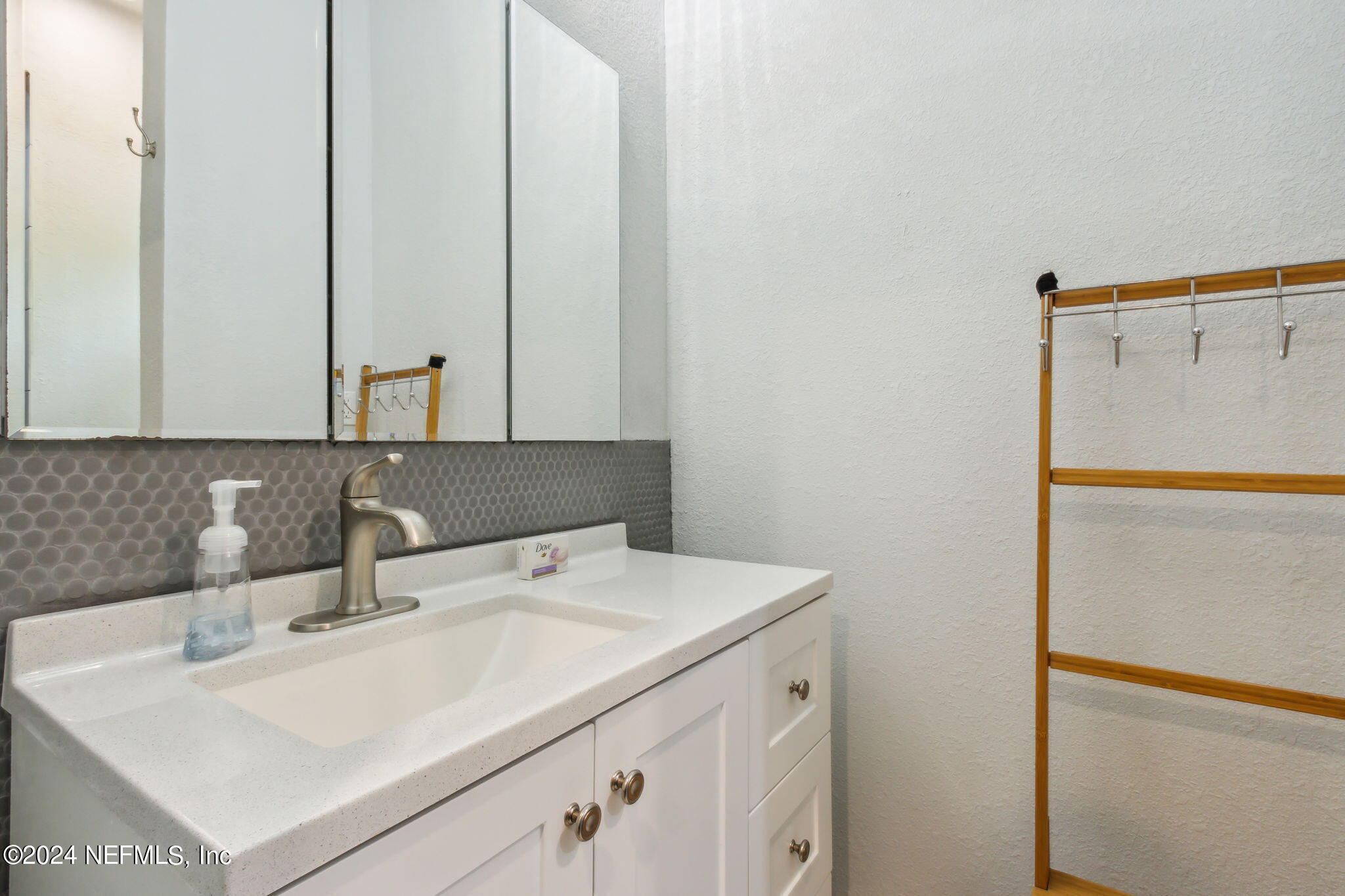 2636 Elbow Road Orange Park, FL 32073 - Photo 36 of 43 a bathroom with a sink and a mirror