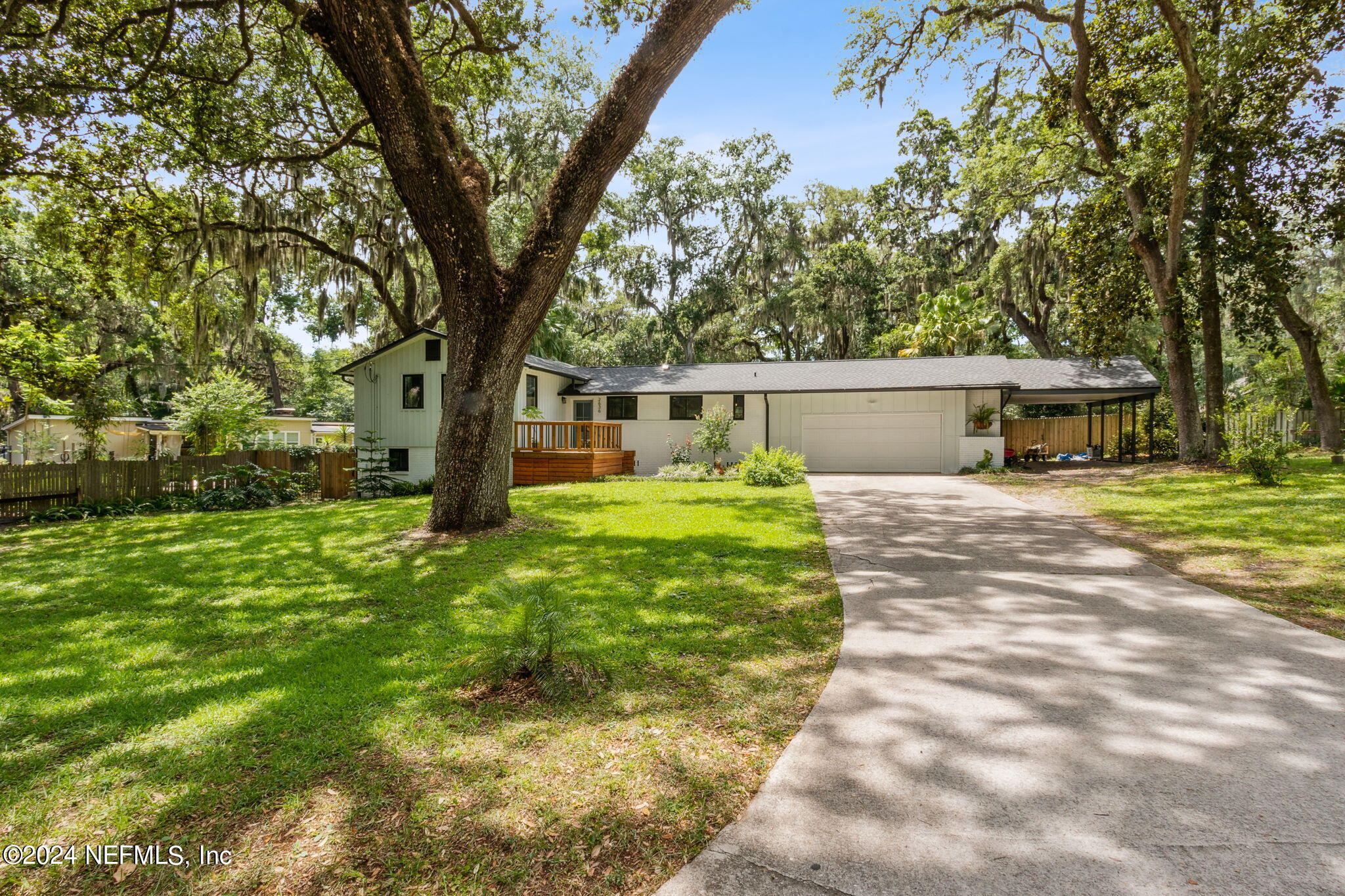 2636 Elbow Road Orange Park, FL 32073 - Photo 4 of 43 a front view of a house with garden