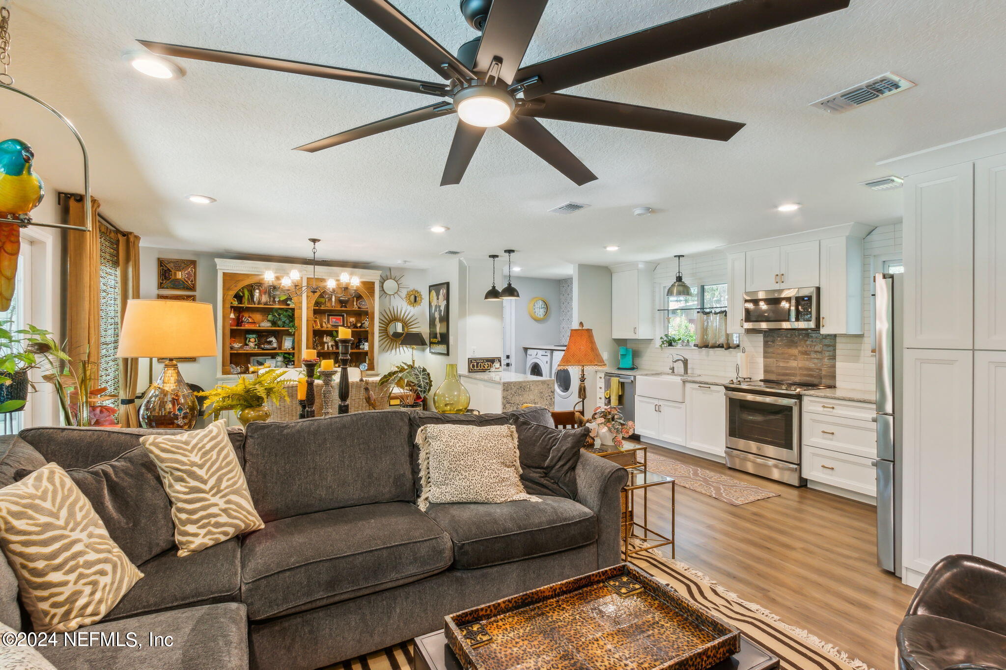 2636 Elbow Road Orange Park, FL 32073 - Photo 10 of 43 a living room with furniture kitchen area and a window
