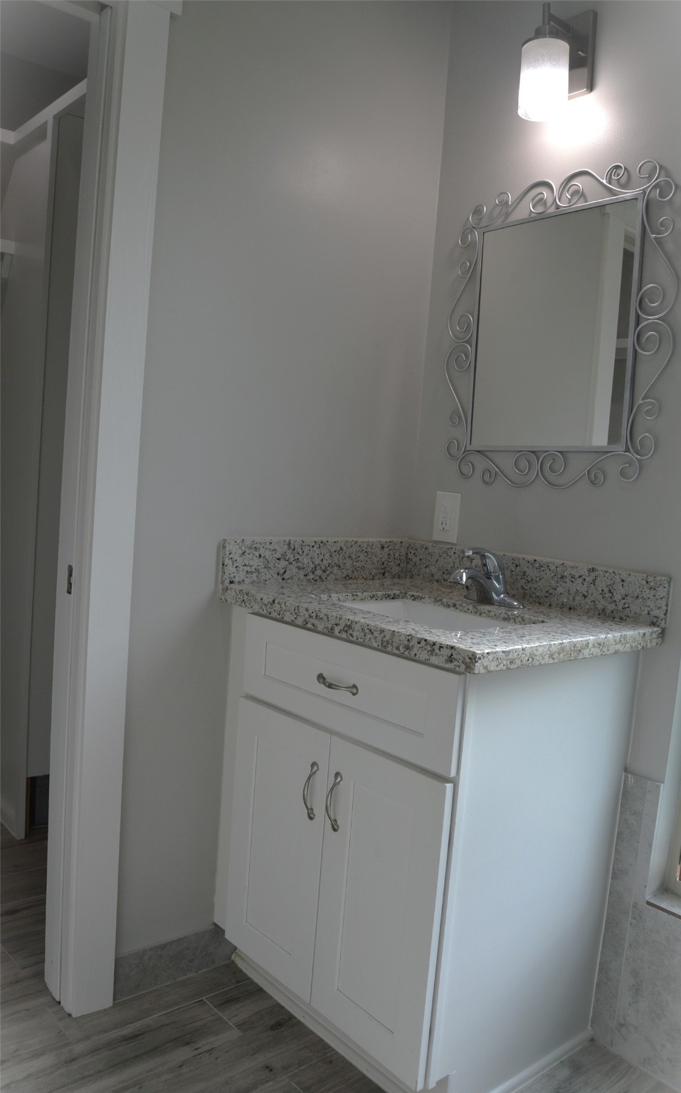 29315 Burton Cemetery Road Waller, TX 77484 - Photo 12 of 22 a bathroom with a granite countertop sink and a mirror