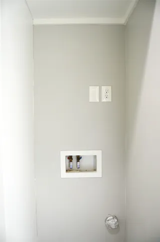 a view of a park with iron fence