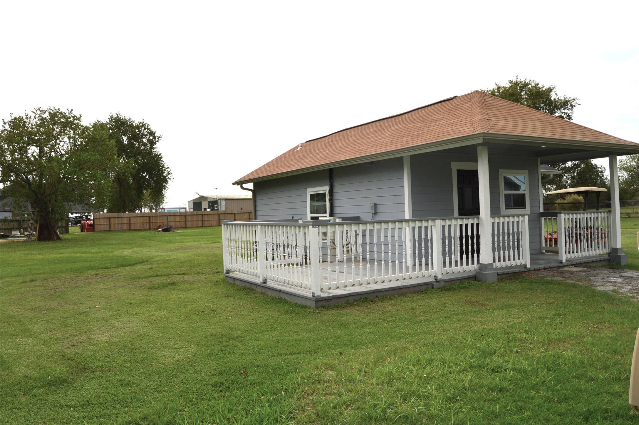 29315 Burton Cemetery Road Waller, TX 77484 - Photo 3 of 22 a view of a house with a yard and deck
