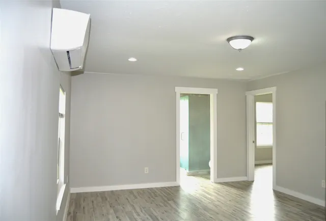 a view of a livingroom with wooden floor