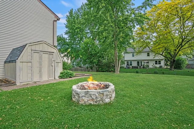 a view of a house with a backyard