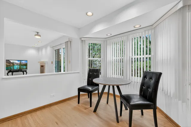a view of a livingroom with furniture and a window
