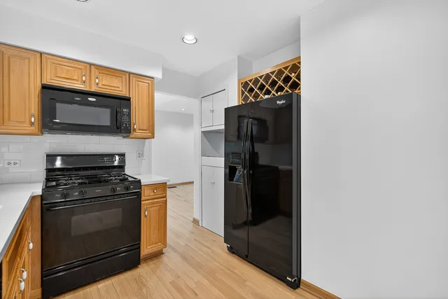 a kitchen with a stove and a microwave