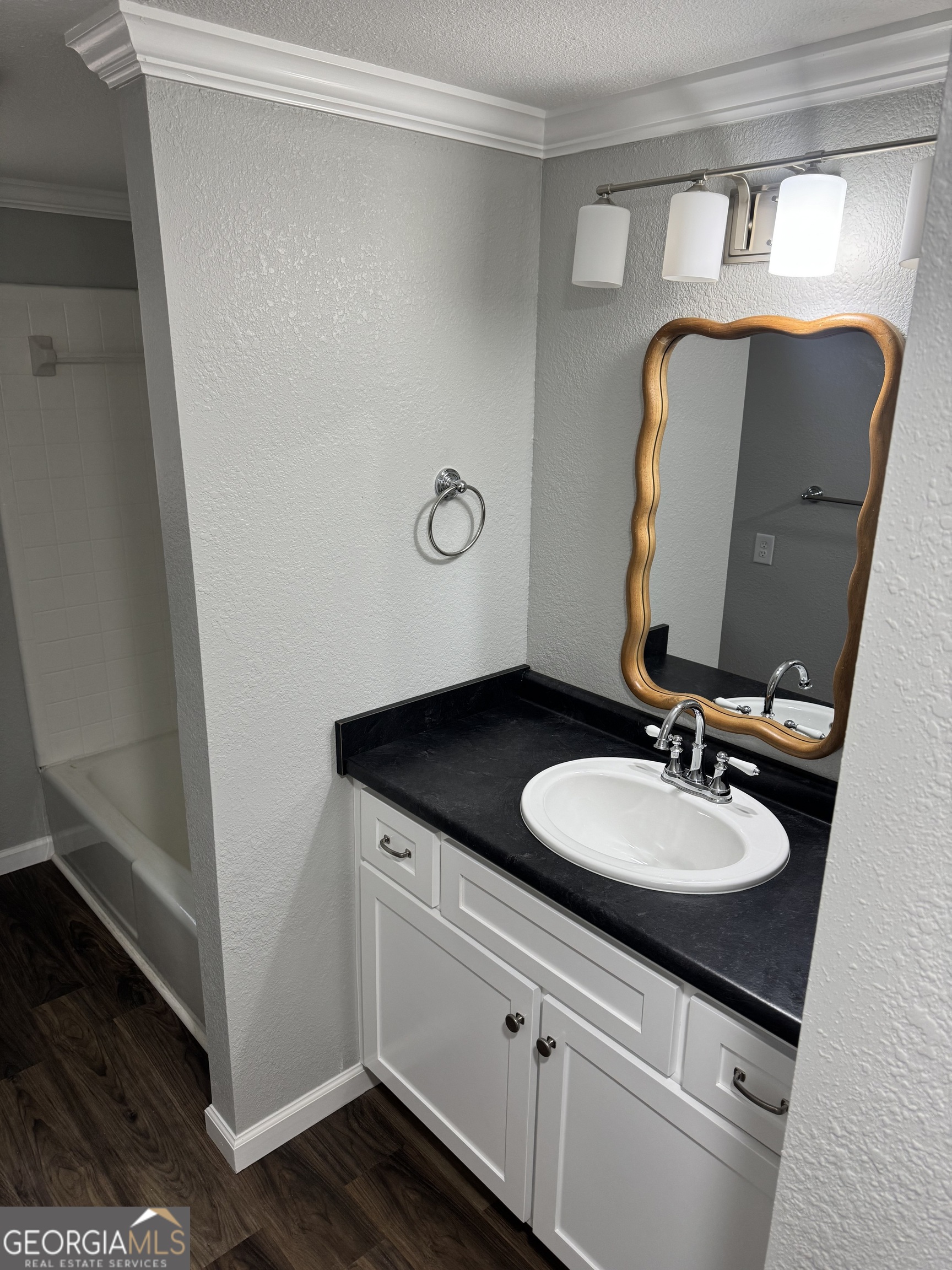 228 Hobbins Drive Dublin, GA 31021 - Photo 5 of 17 a bathroom with a granite countertop sink and a mirror