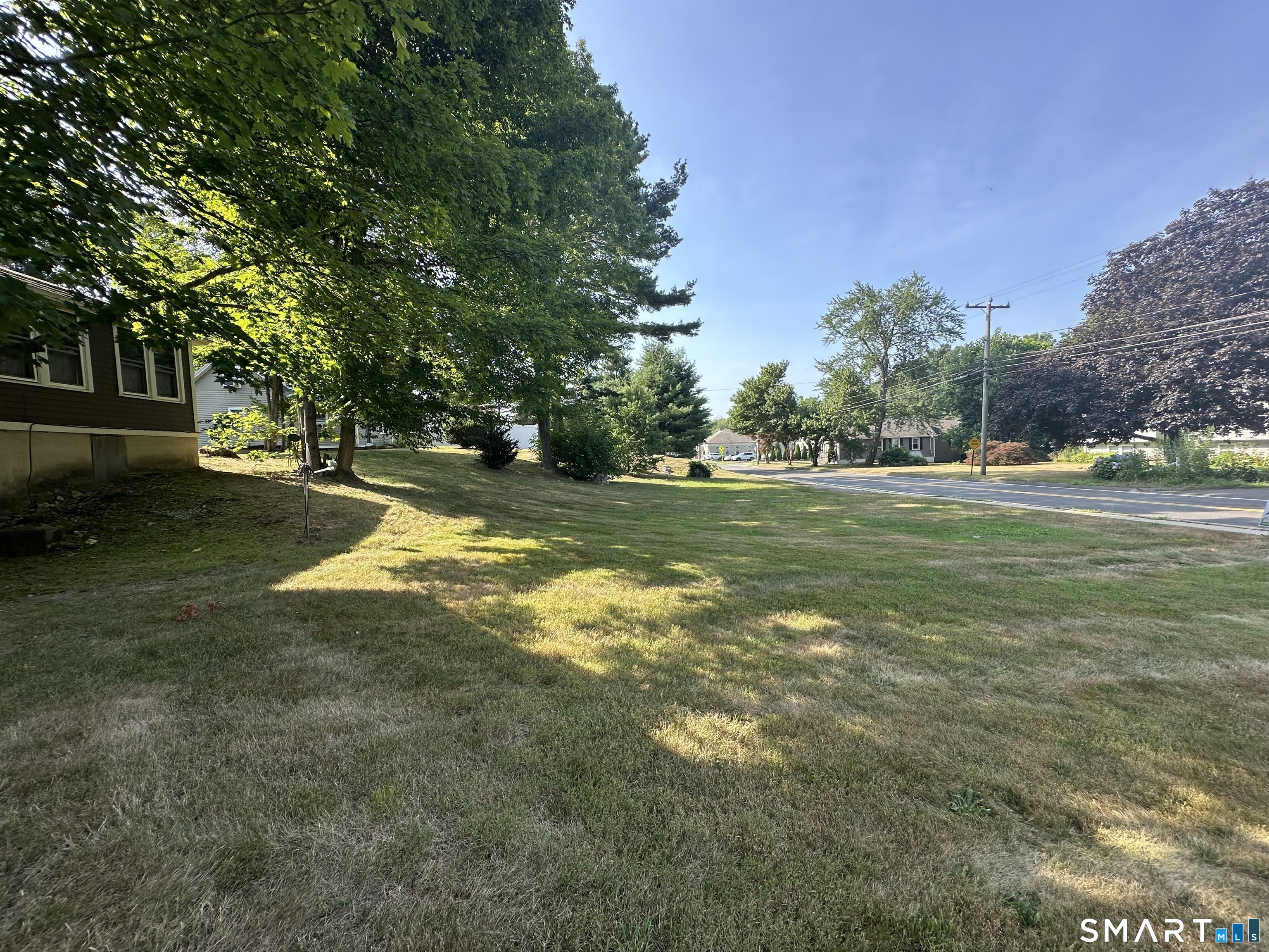 22 North Main Street, Unit 2 East Hampton, CT 06424 - Photo 16 of 17 Front yard is expansive and level.