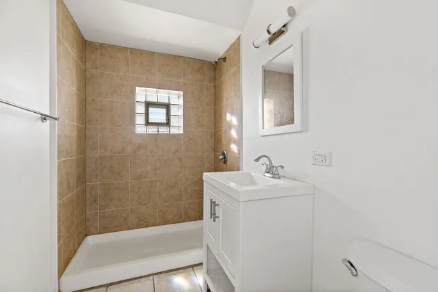 a bathroom with a sink a mirror and a bathtub