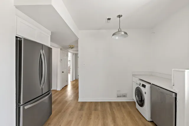 a view of empty room with washer and dryer