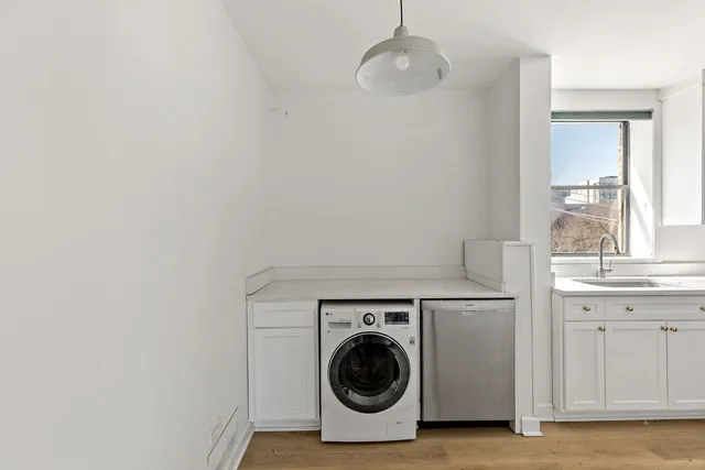 a utility room with dryer and washer