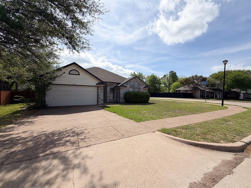 1000 Short Line Boulevard Midlothian, TX 76065 - Photo 1 of 23 a front view of a house with a yard and garage