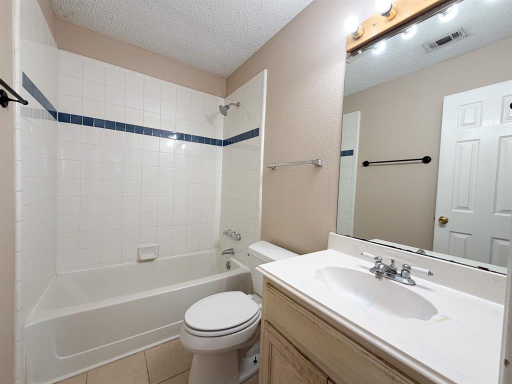 1000 Short Line Boulevard Midlothian, TX 76065 - Photo 11 of 23 a bathroom with a sink toilet and shower