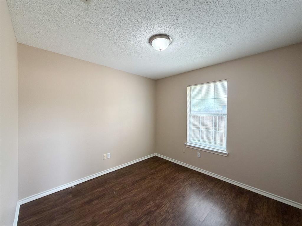1000 Short Line Boulevard Midlothian, TX 76065 - Photo 14 of 23 an empty room with wooden floor and windows