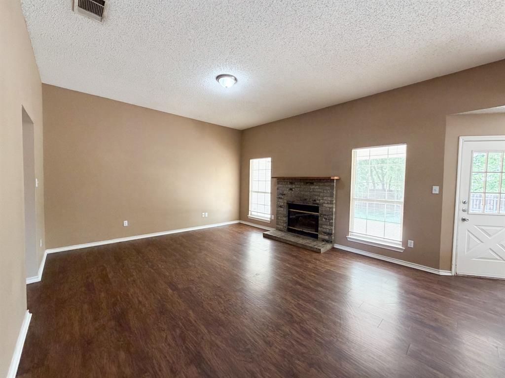 1000 Short Line Boulevard Midlothian, TX 76065 - Photo 15 of 23 a view of empty room with wooden floor and fireplace