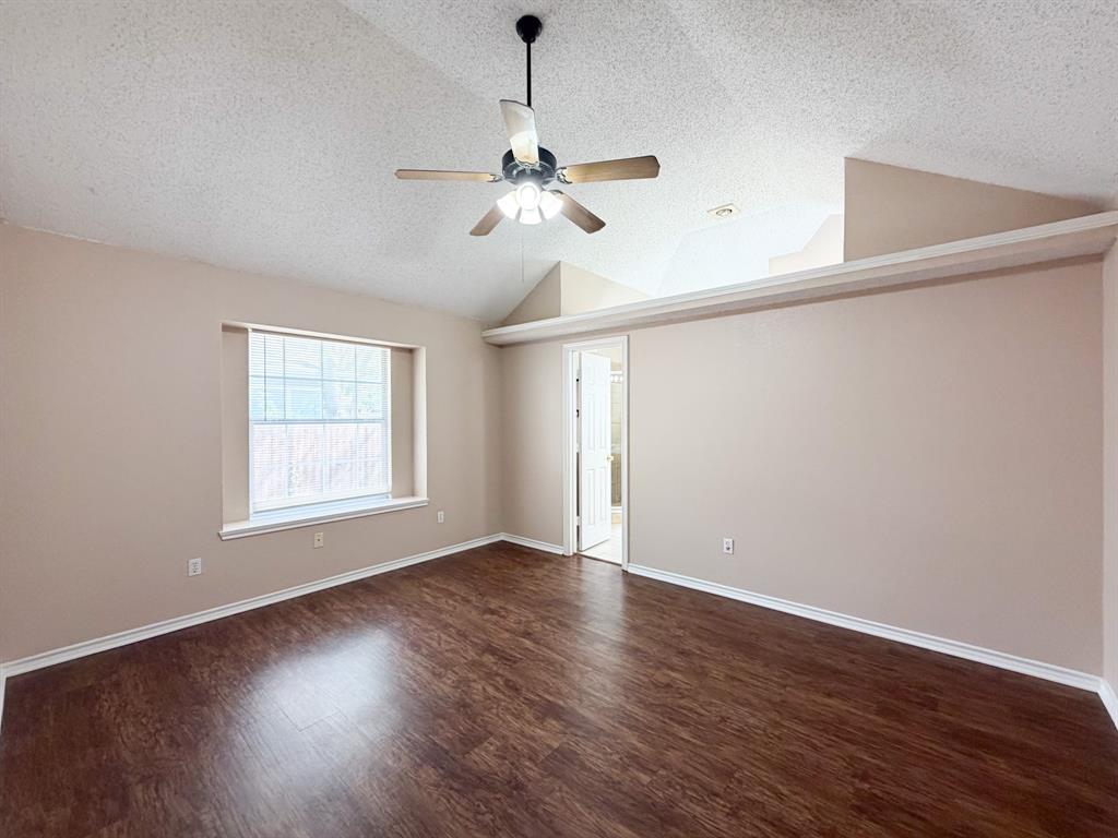 1000 Short Line Boulevard Midlothian, TX 76065 - Photo 17 of 23 a view of an empty room with wooden floor and a window