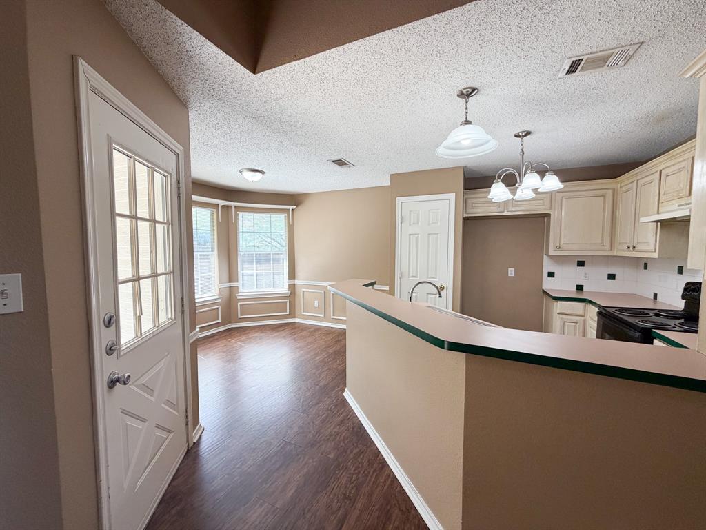 1000 Short Line Boulevard Midlothian, TX 76065 - Photo 6 of 23 a kitchen with granite countertop a sink cabinets and wooden floor