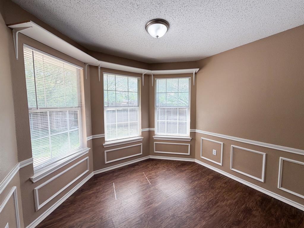 1000 Short Line Boulevard Midlothian, TX 76065 - Photo 7 of 23 an empty room with wooden floor and windows