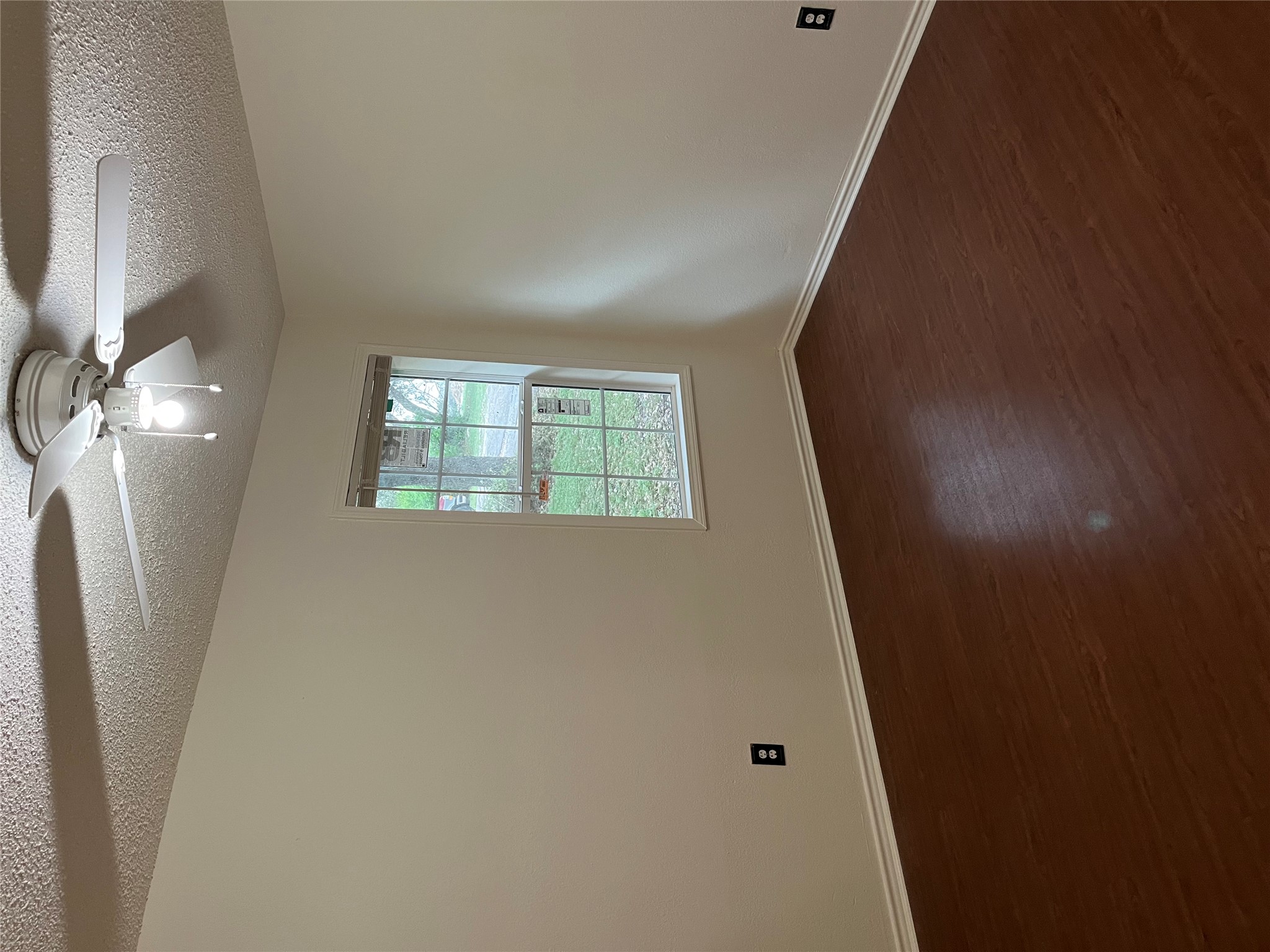 23393 Nameless Road, Unit 144 Leander, TX 78641 - Photo 12 of 23 Spare room with a textured ceiling, dark wood-style flooring, baseboards, and a ceiling fan