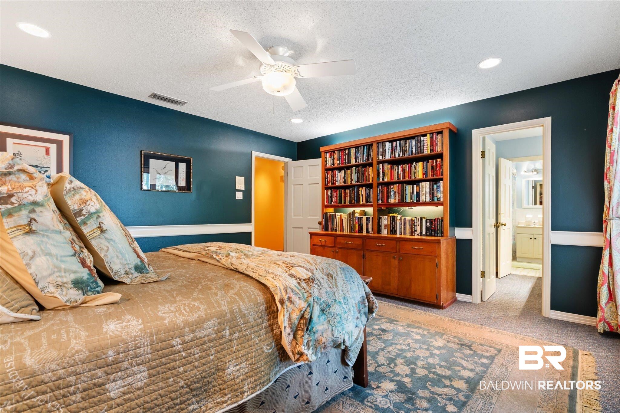 3325 Riviere Du Chien Road Mobile, AL 36693 - Photo 27 of 71 Carpeted bedroom featuring ceiling fan, a textured ceiling, and ensuite bath
