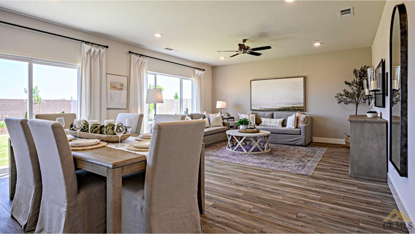 Undisclosed Address Bakersfield, CA 93313 - Photo 6 of 14 a living room with furniture a large window and flat screen tv
