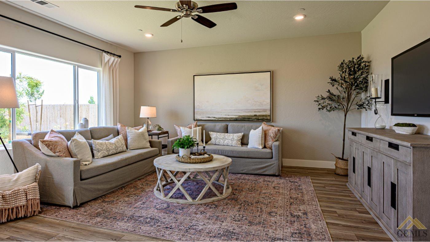 Undisclosed Address Bakersfield, CA 93313 - Photo 7 of 14 a living room with furniture and a flat screen tv
