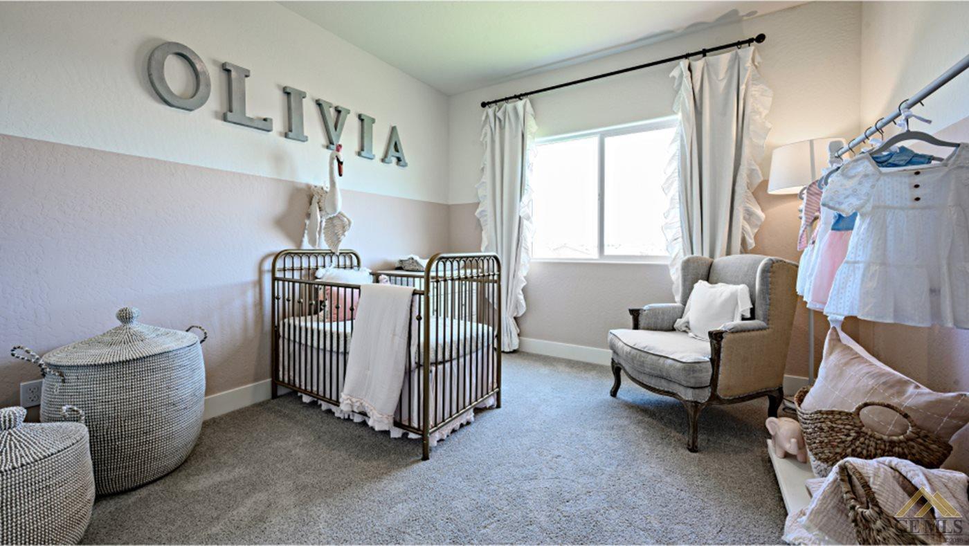 Undisclosed Address Bakersfield, CA 93313 - Photo 10 of 14 a bedroom with furniture and a window