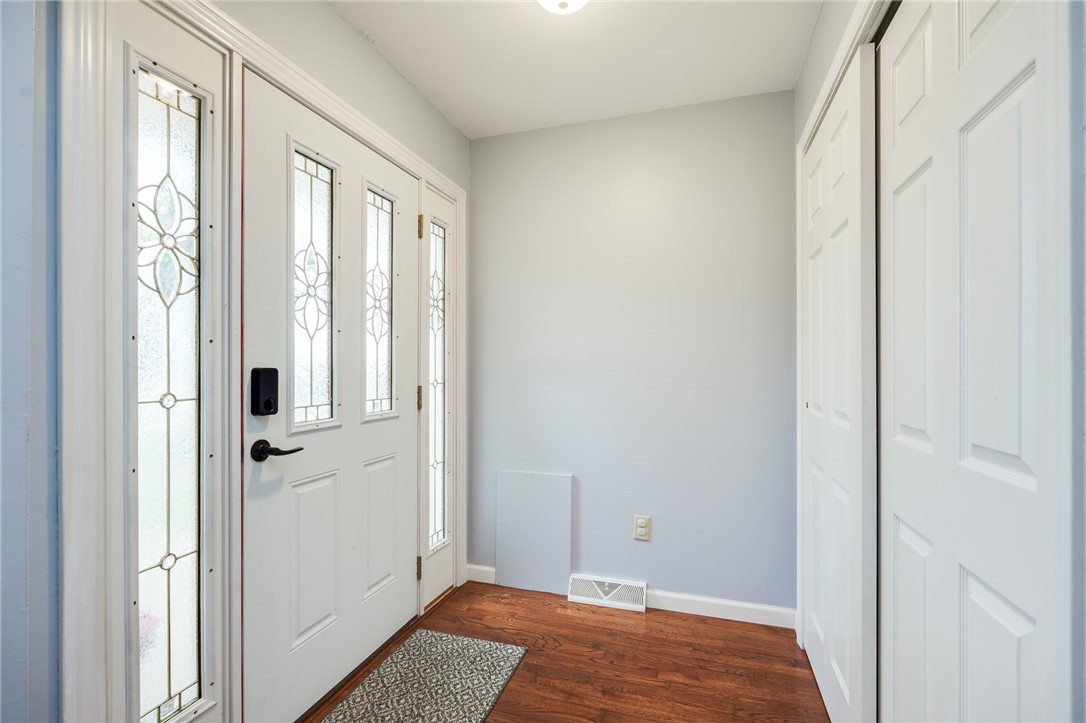 6950 Red Lion 5 Points Road Springboro, OH 45066 - Photo 8 of 78 Enter into a welcoming entryway featuring a striking front door and beautiful flooring.