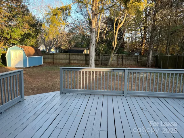 a view of deck with wooden floor and fence
