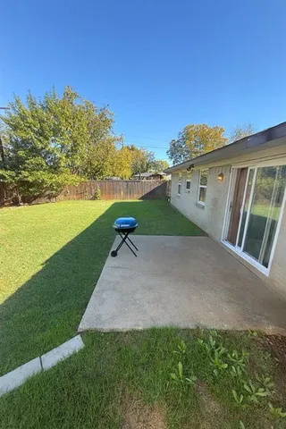 a view of a yard with an ocean view