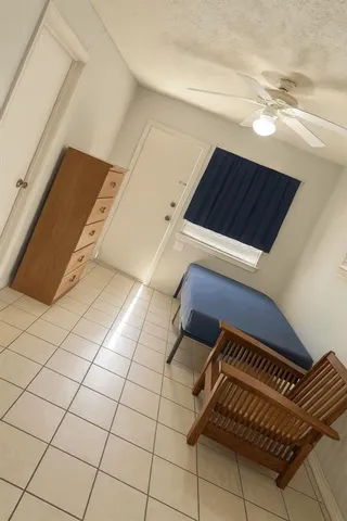 a view of an empty room and wooden floor