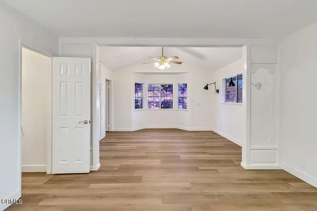 a view of an entryway with wooden floor