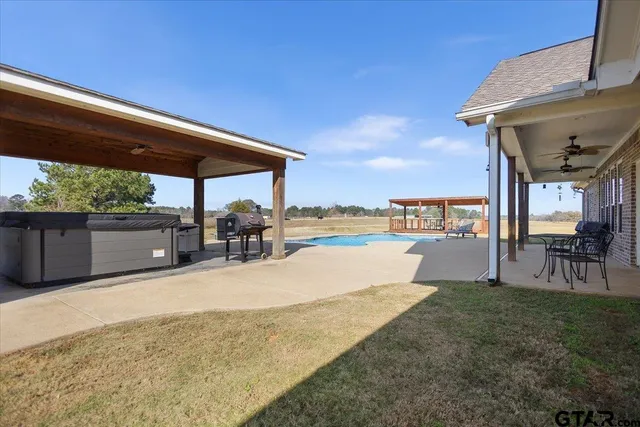 a house with swimming pool in front of it