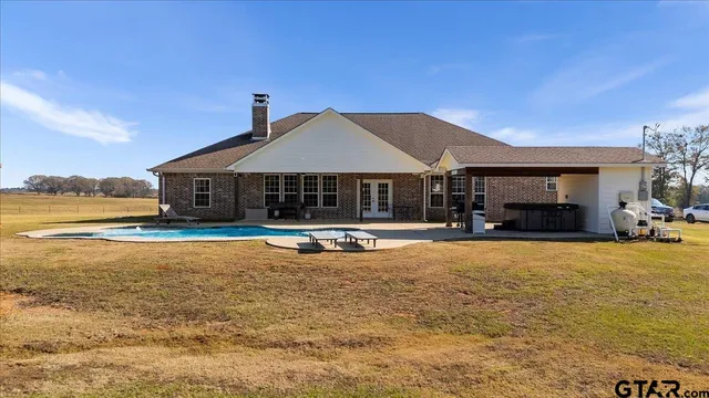 a aerial view of a house with outdoor space