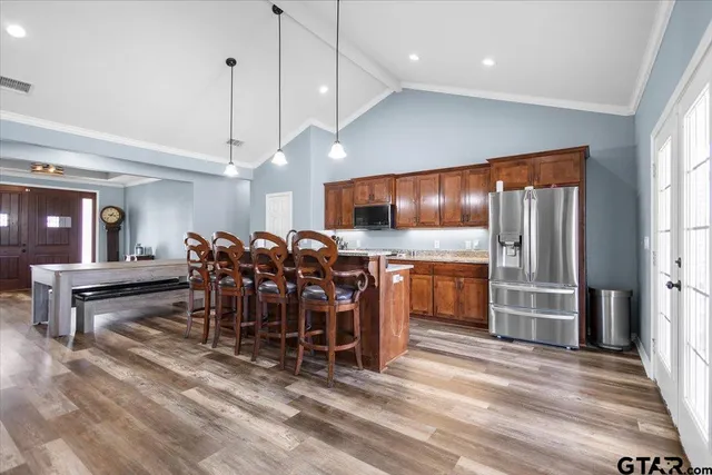 a very nice looking dining room with furniture window and wooden floor