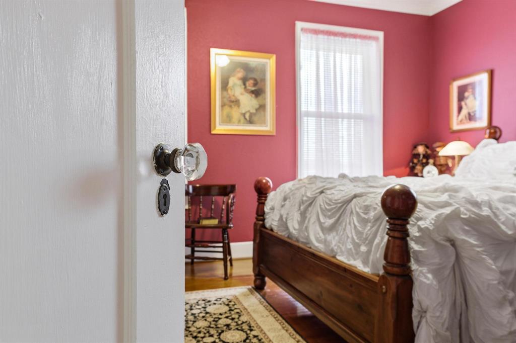 304 East 9th Street Bonham, TX 75418 - Photo 19 of 39 a bedroom with a bed and a window