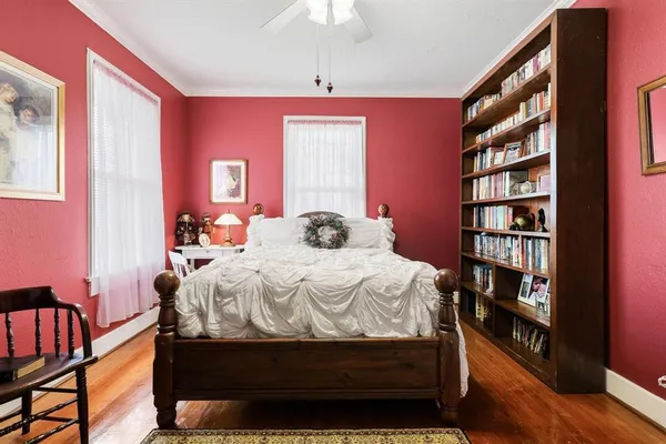 a bedroom with a bed and a bookshelf